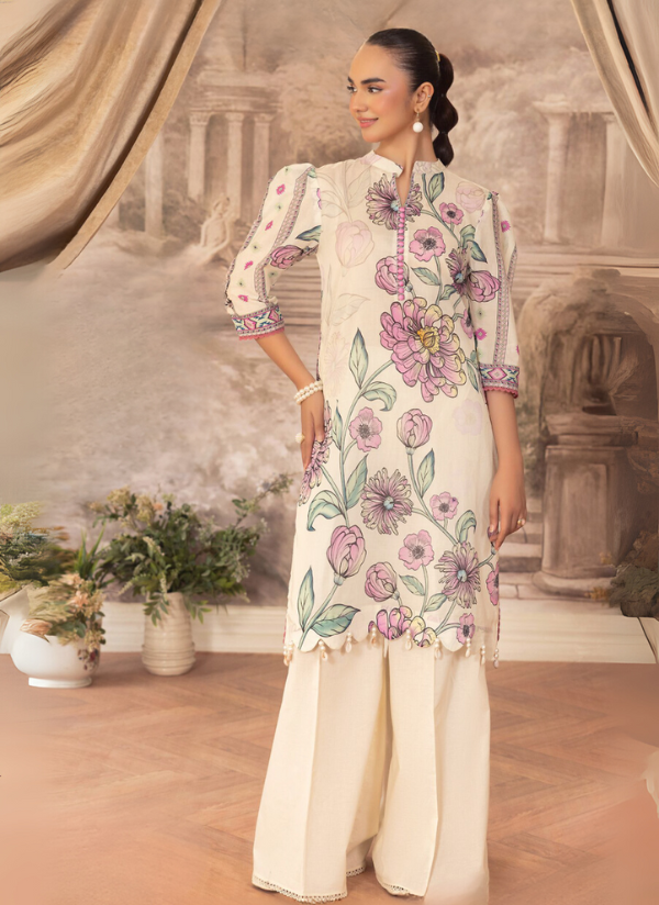 Woman wearing a floral embroidered outfit in a decorative room with flowers and curtains.